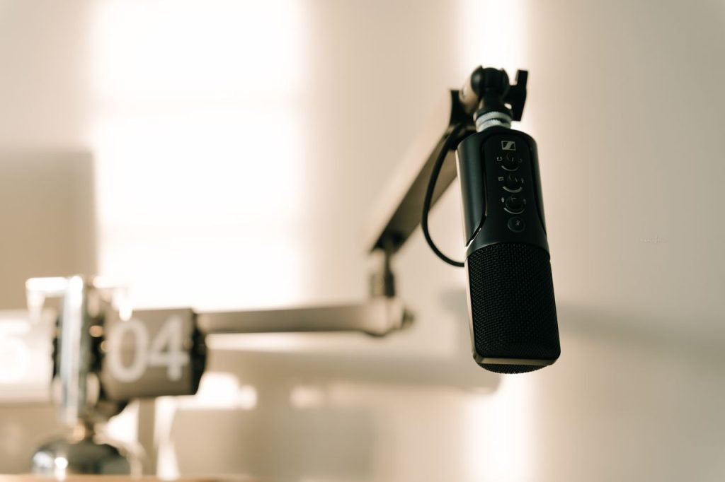 Crafting Captivating Headlines: Your awesome post title goes here A sleek professional microphone on a boom arm in a minimalist studio.